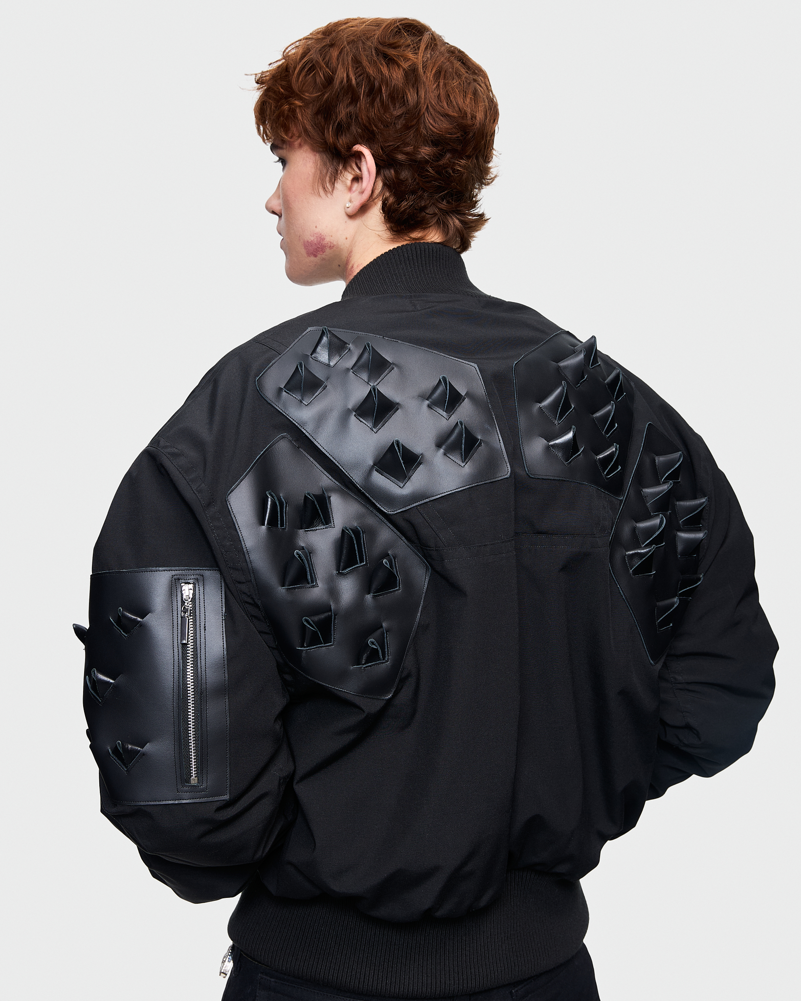 - Croptop padded bomber jacket<br />- Oversize fit<br />- Croco 3-D leather patches<br />- Dropped shoulders