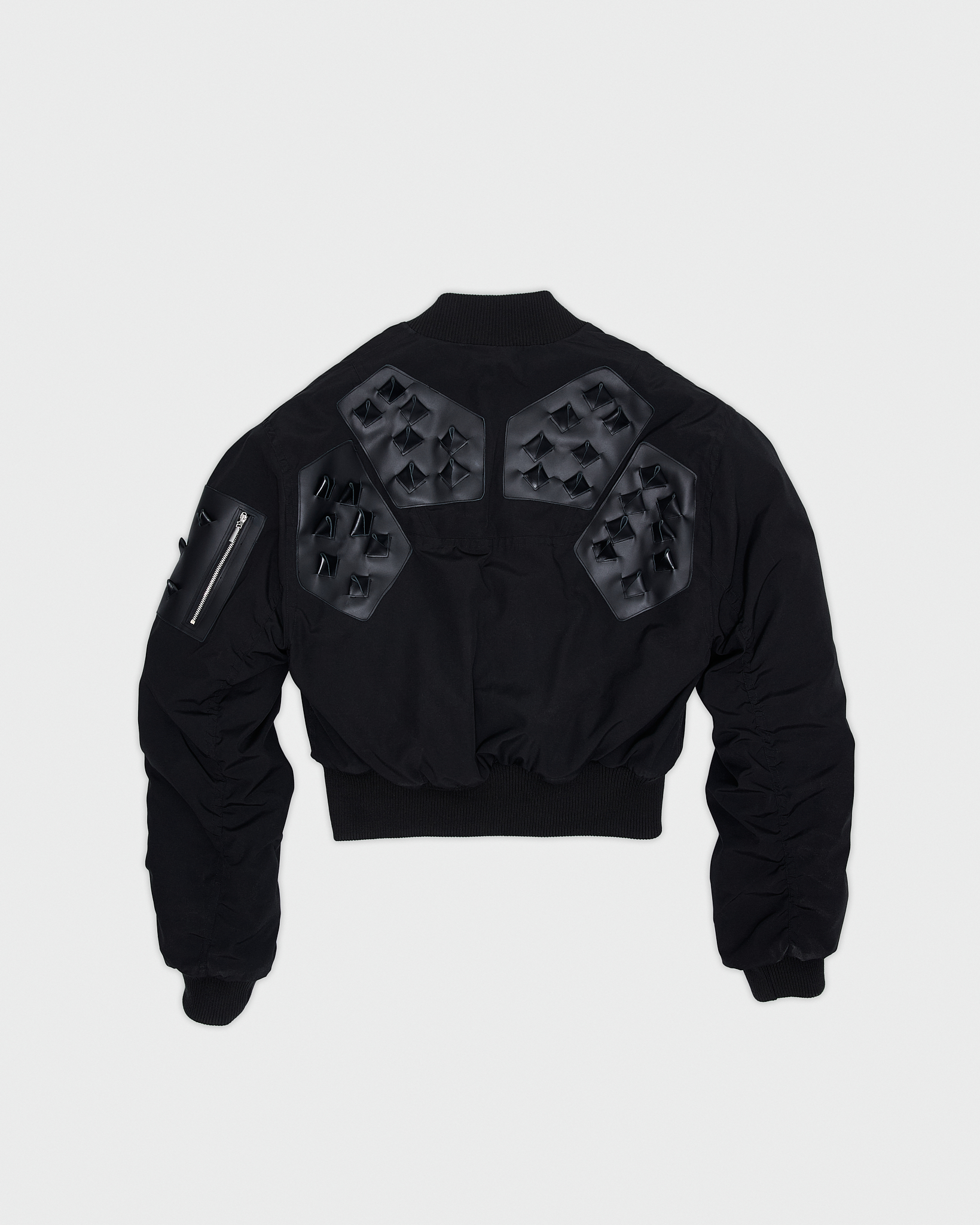 - Croptop padded bomber jacket<br />- Oversize fit<br />- Croco 3-D leather patches<br />- Dropped shoulders