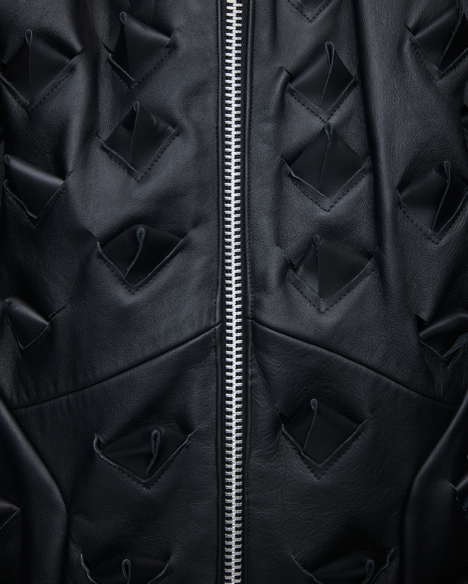 - Leather vest<br />- Oversized fit<br />- Croco 3-D leather are applied all over the vest
