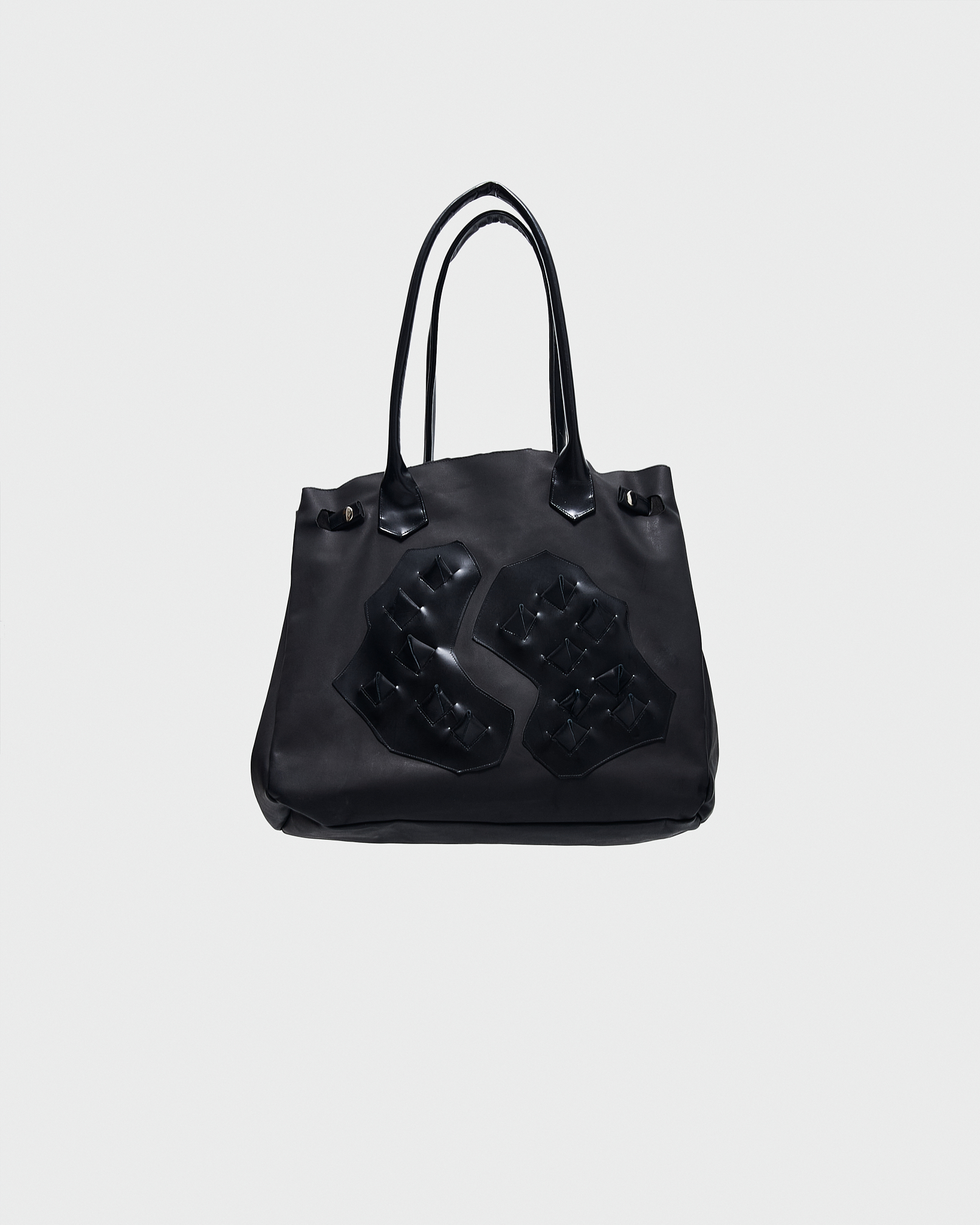 - Handbag<br />- Shoulder and hand carry<br />- Elongated leather handles<br />- Black croco 3-D leather patches