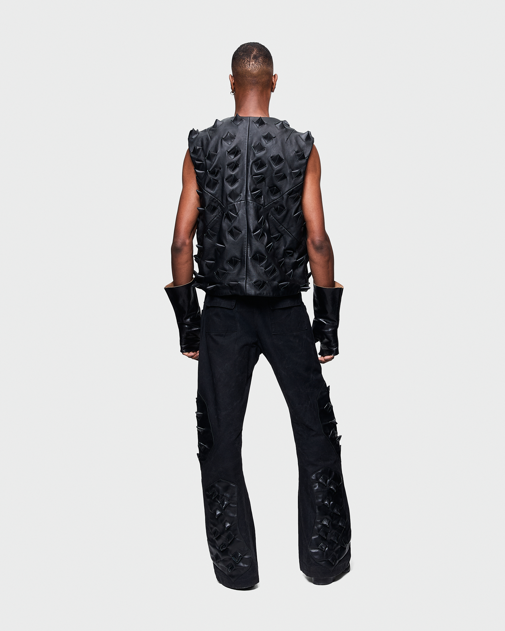 - Leather vest<br />- Oversized fit<br />- Croco 3-D leather are applied all over the vest