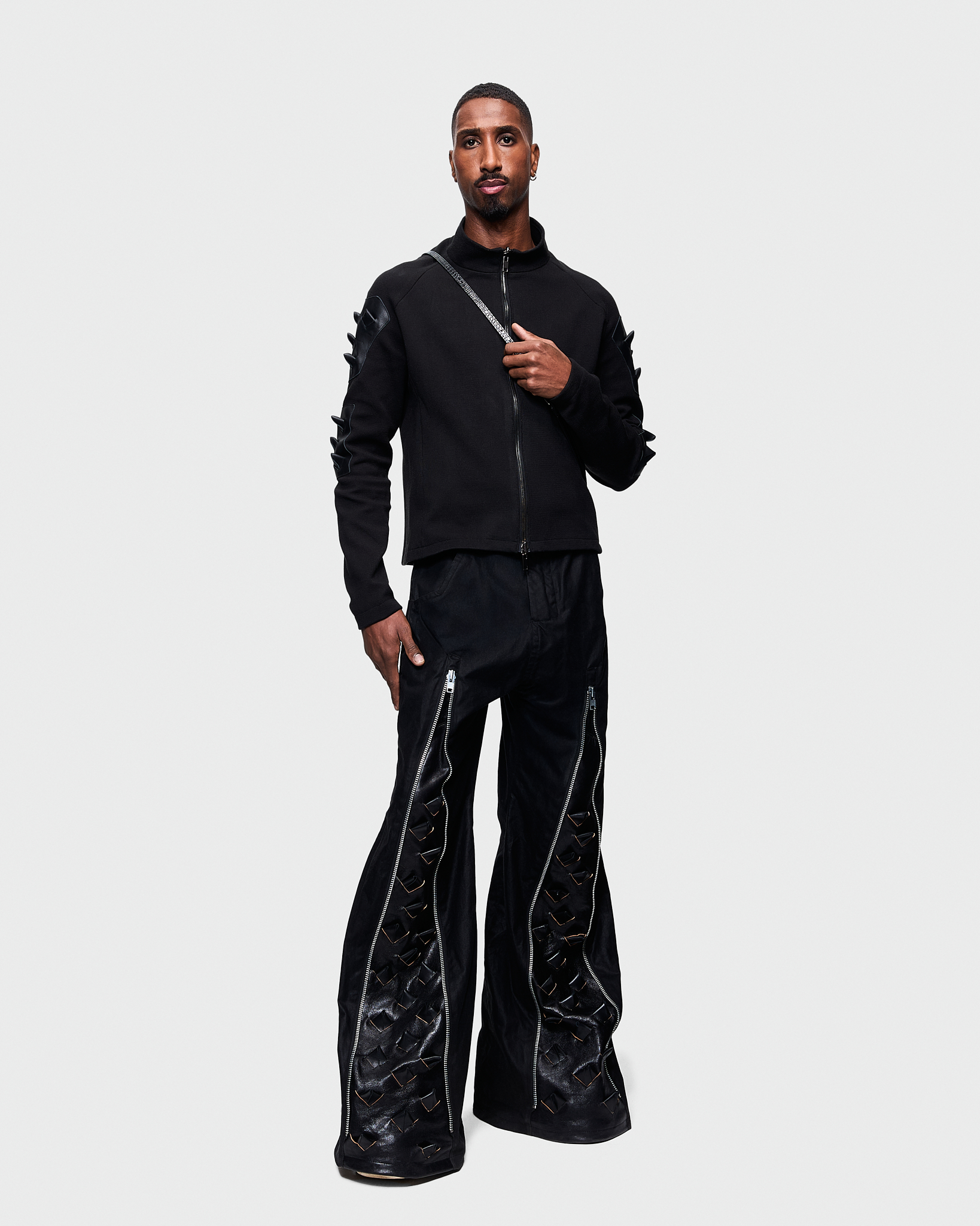 - Full zip pull over <br />- Slim fit<br />- Croco 3-D leather patches