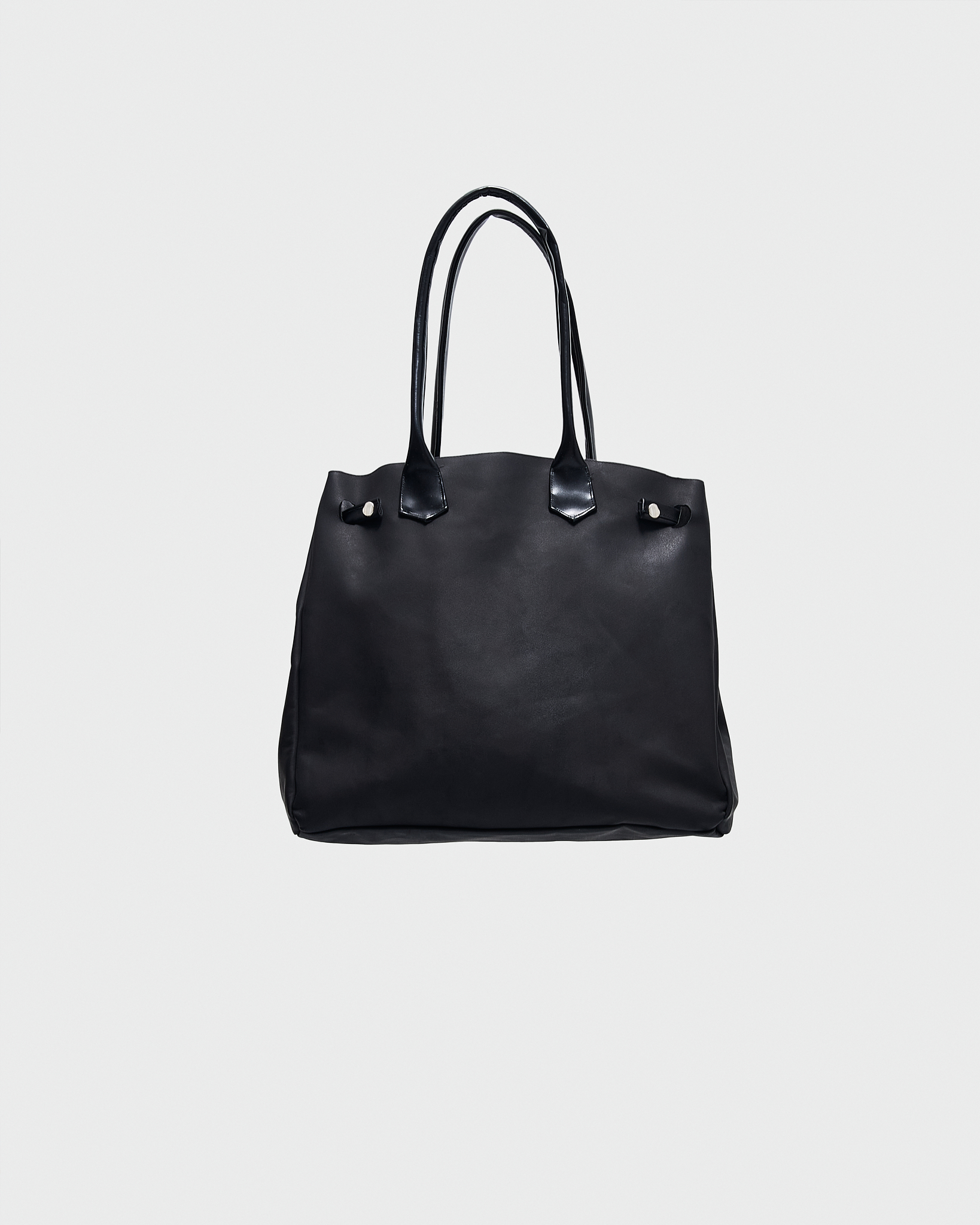 - Handbag<br />- Shoulder and hand carry<br />- Elongated leather handles<br />- Black croco 3-D leather patches