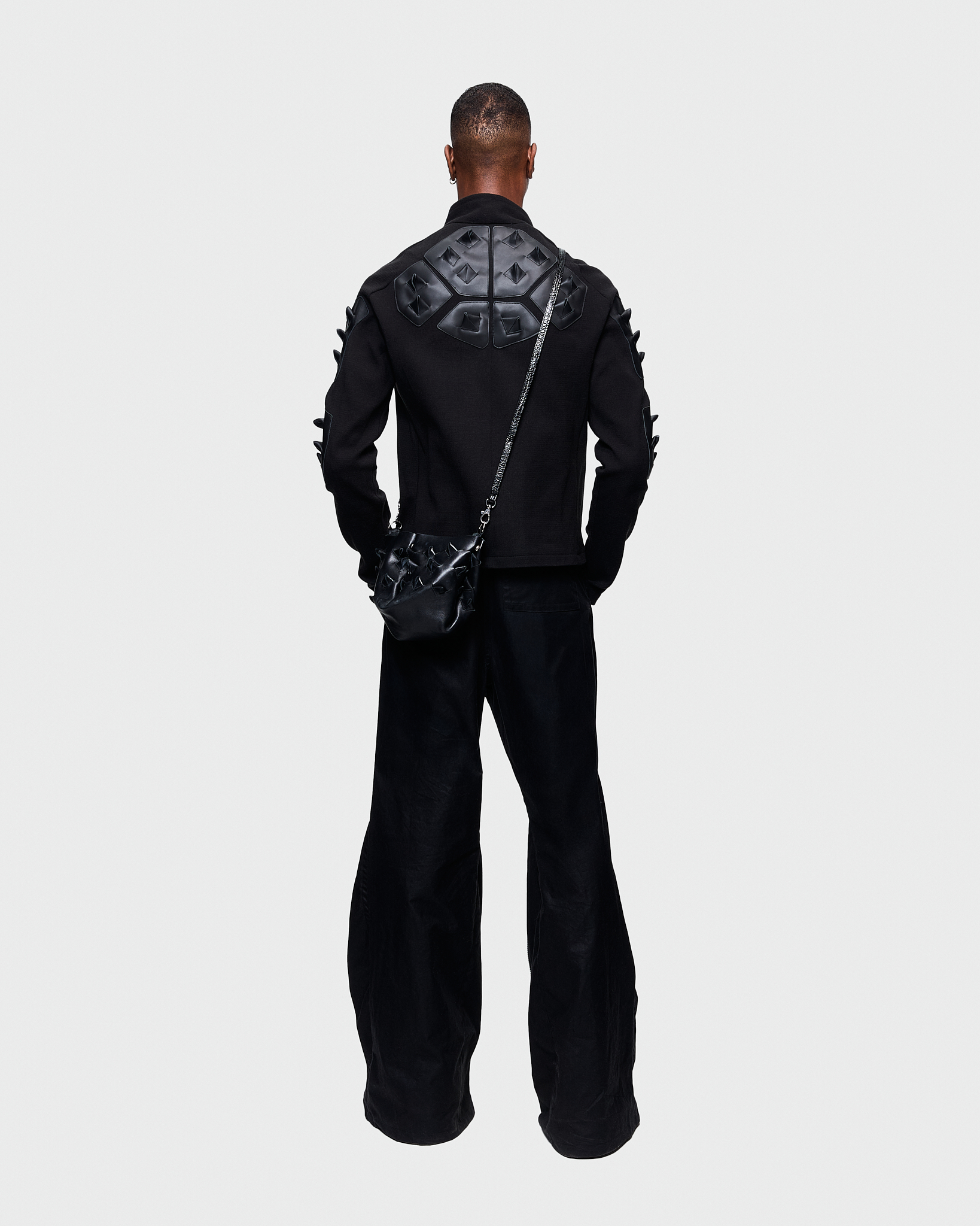 - Full zip pull over <br />- Slim fit<br />- Croco 3-D leather patches