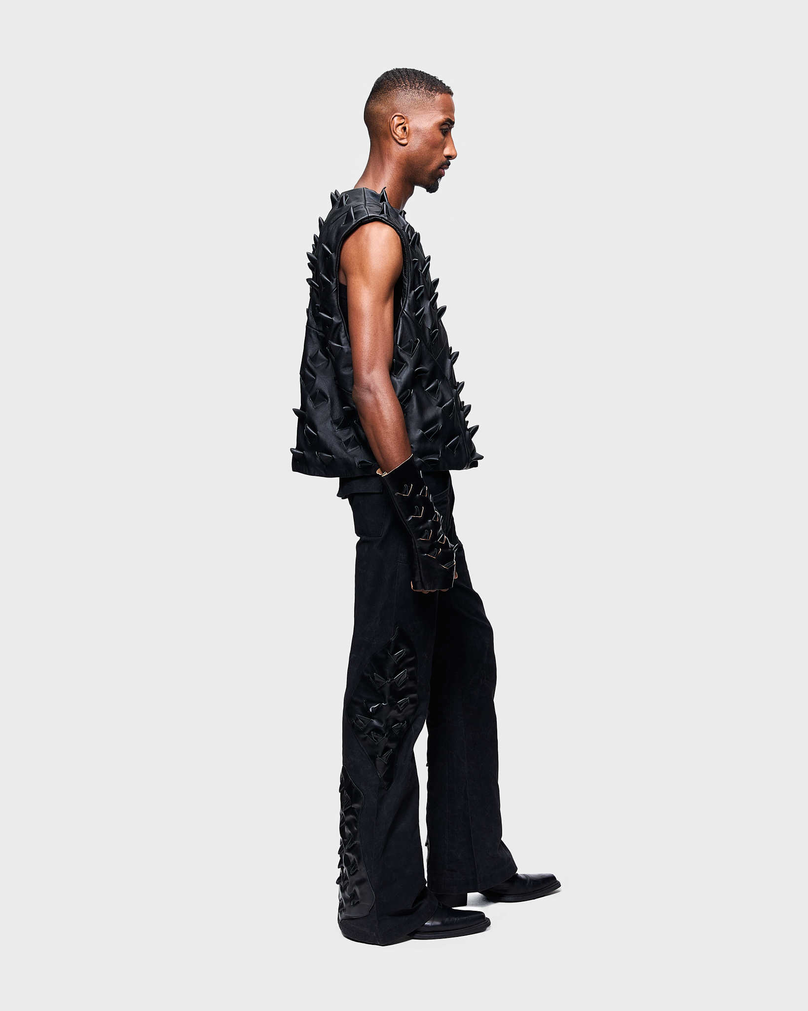 - Leather vest<br />- Oversized fit<br />- Croco 3-D leather are applied all over the vest