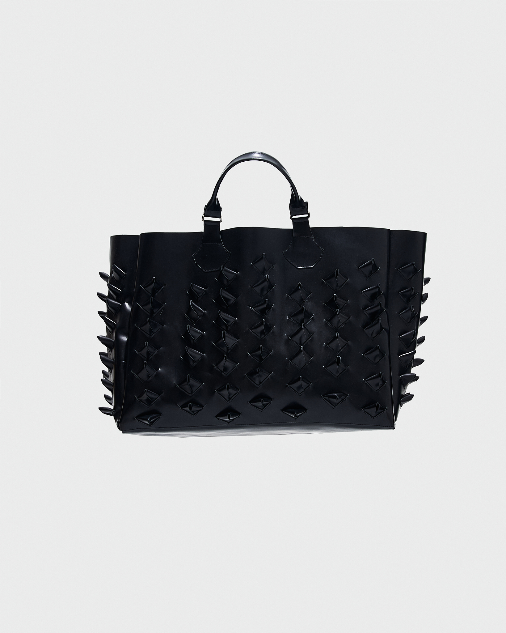 - Tote bag<br />- Croco 3-D leather spikes all over the bag<br />- Leather handles