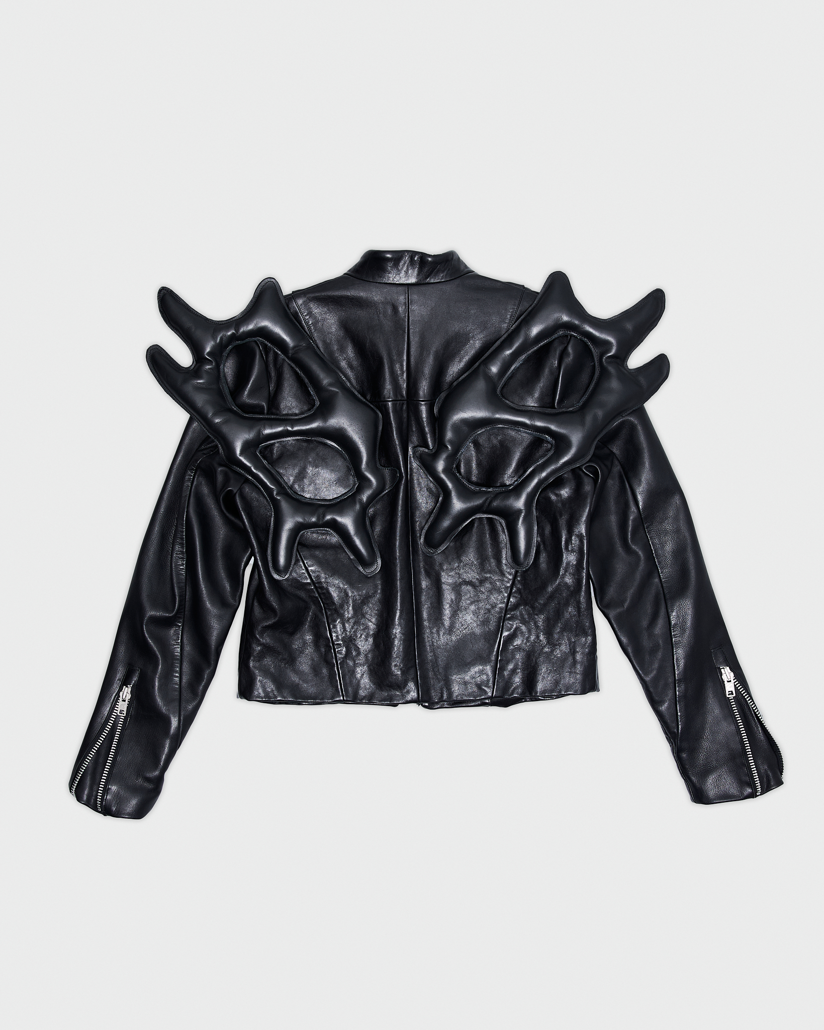- Biker leather jacket<br />- Straight fit <br />- Back feature detachable leather wings<br />- Off center zipper