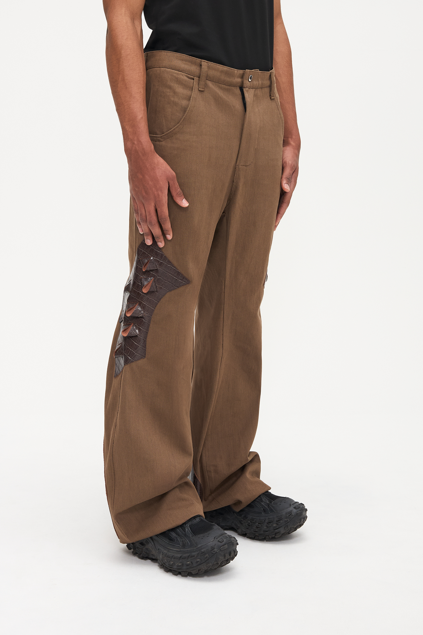 - Flared fit<br />- Deadstock brown denim<br />- Brown croco 3-D leather patches