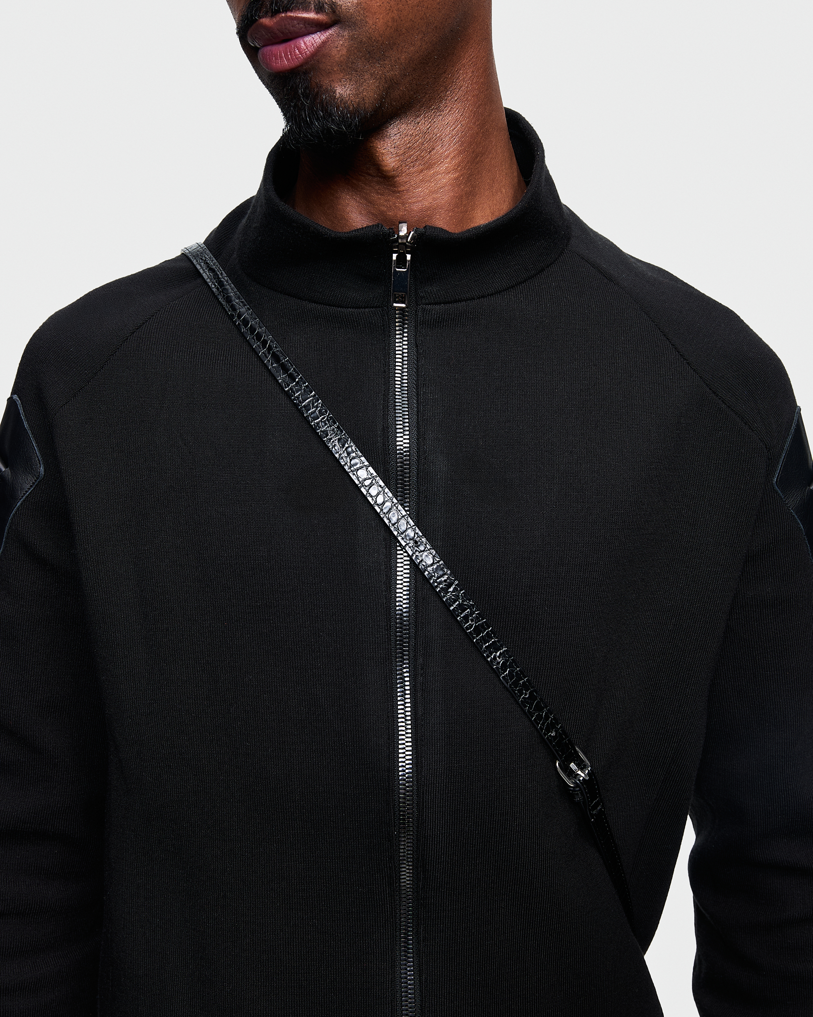 - Full zip pull over <br />- Slim fit<br />- Croco 3-D leather patches