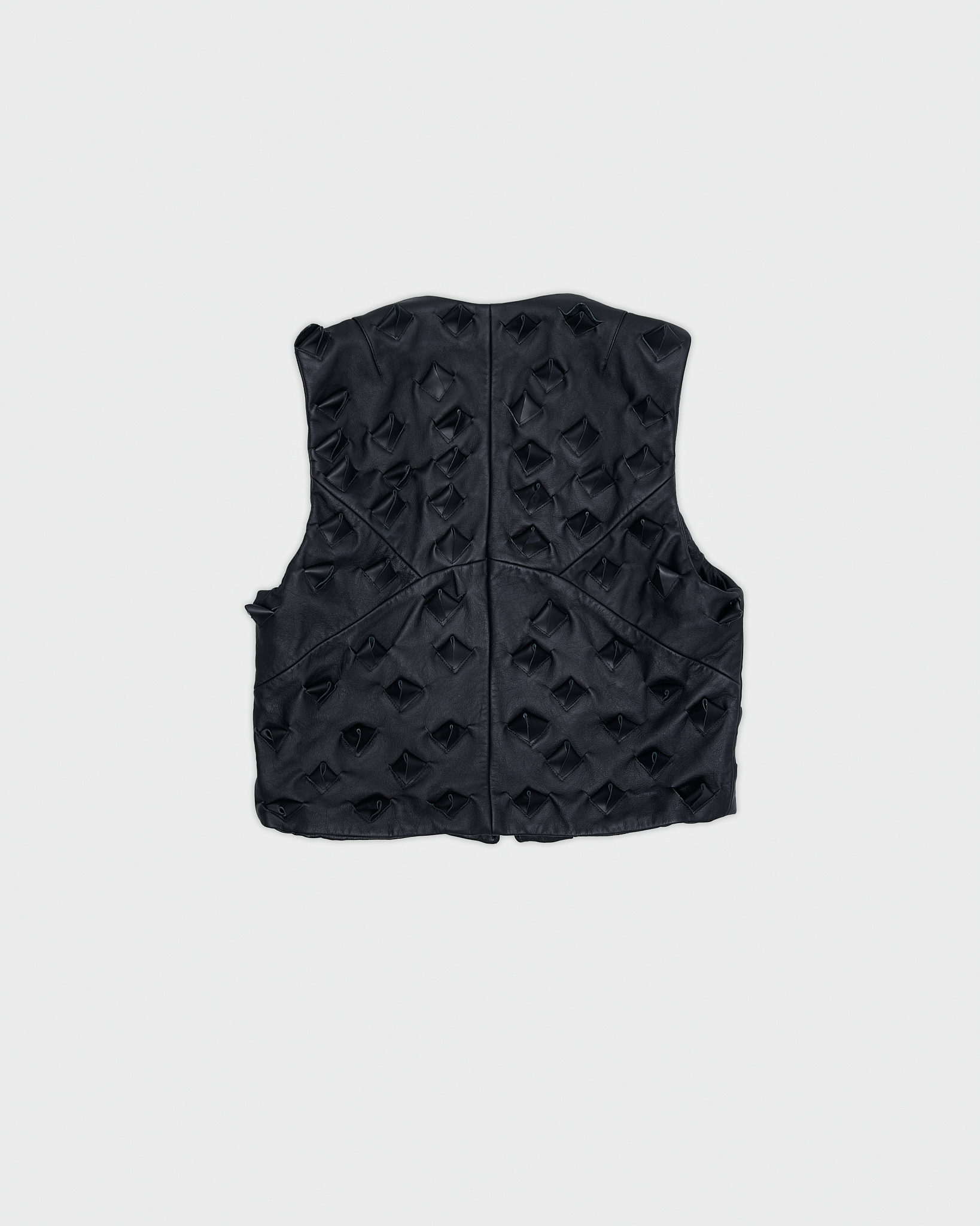- Leather vest<br />- Oversized fit<br />- Croco 3-D leather are applied all over the vest